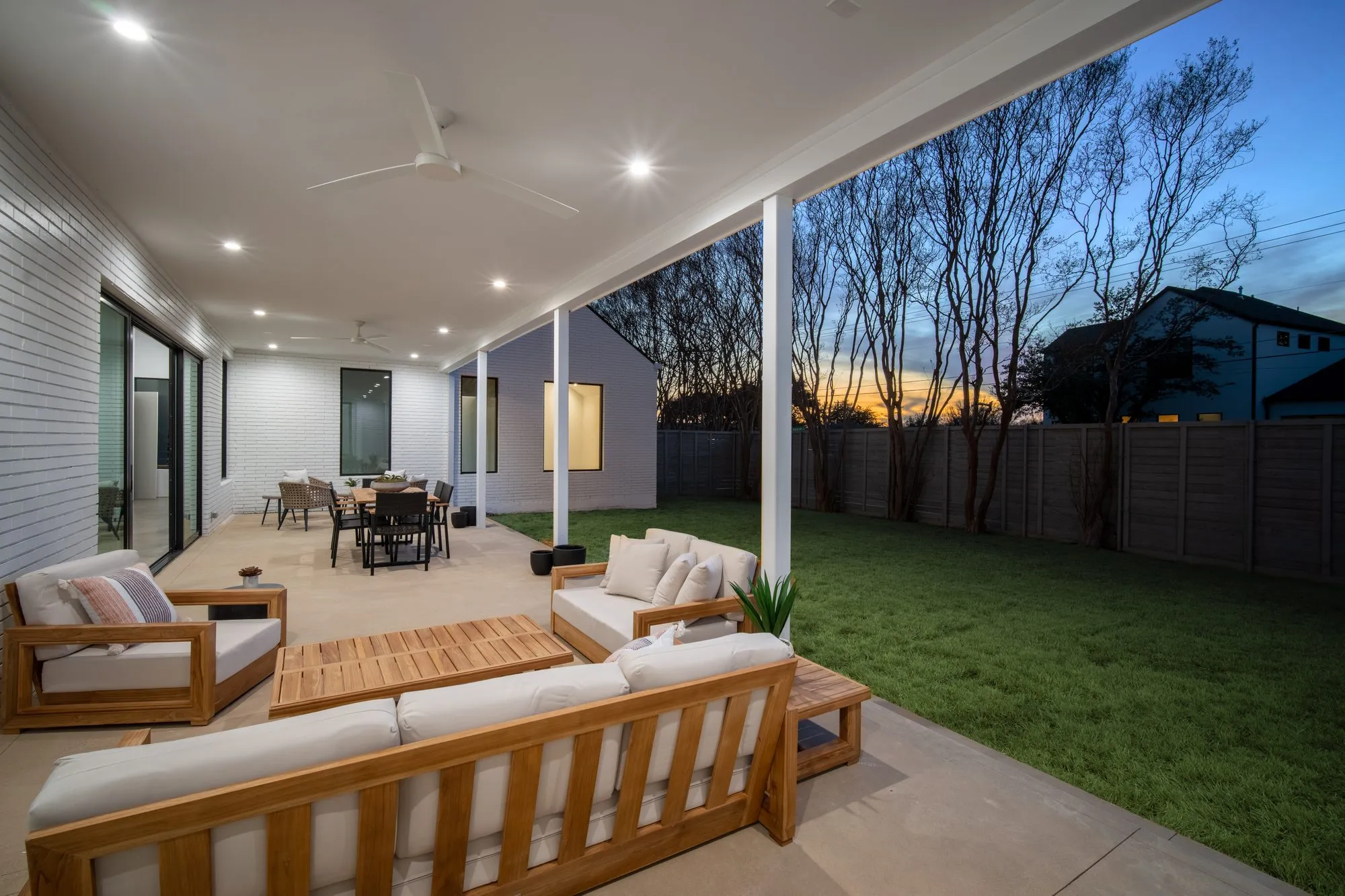 3805 Eaton Drive: covered patio with outdoor seating at dusk