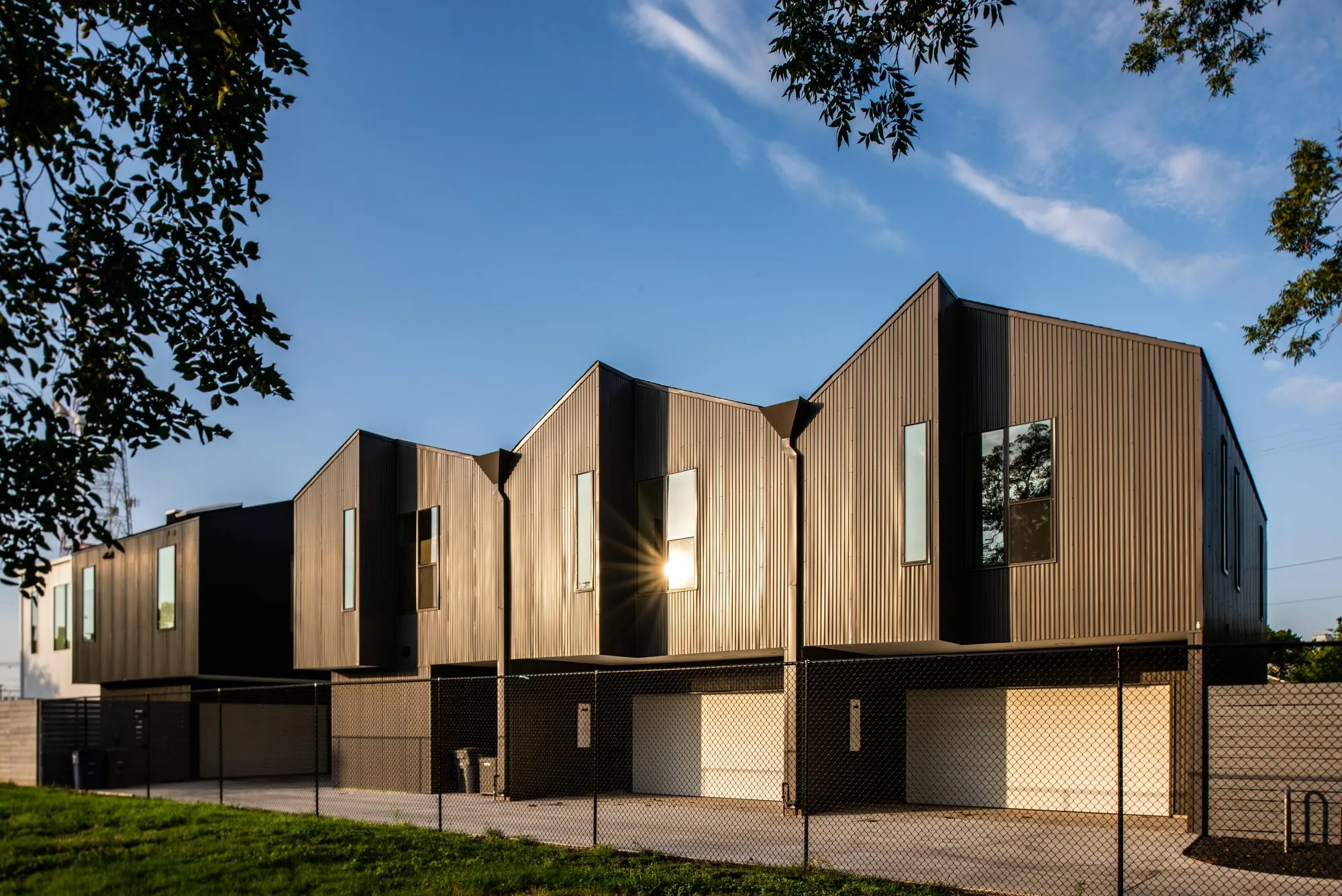 4401 Scurry Street: garage side of the townhomes at sunset