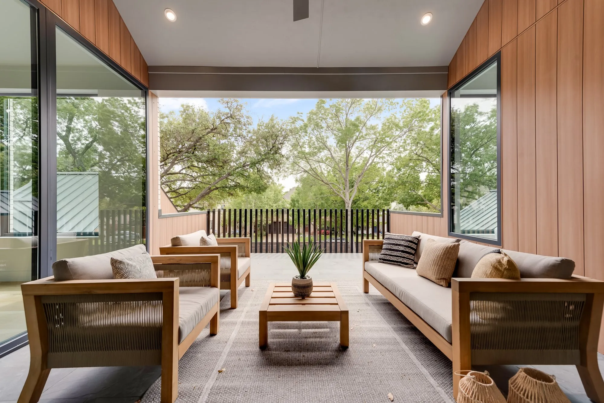 4103 Saranac: covered balcony with outdoor seating and a view of the trees