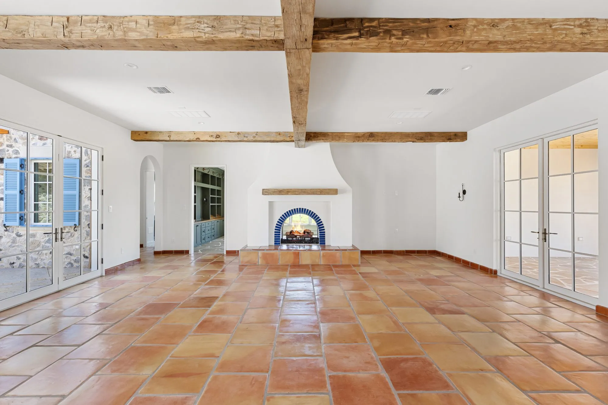 721 Eagles Landing: great room with exposed beams and terracotta floors