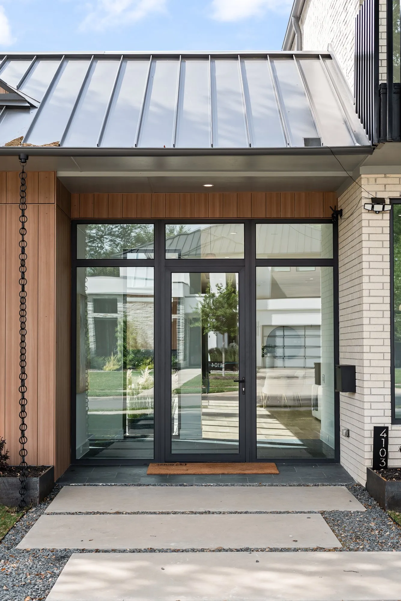 Glass front doors under the metal roof