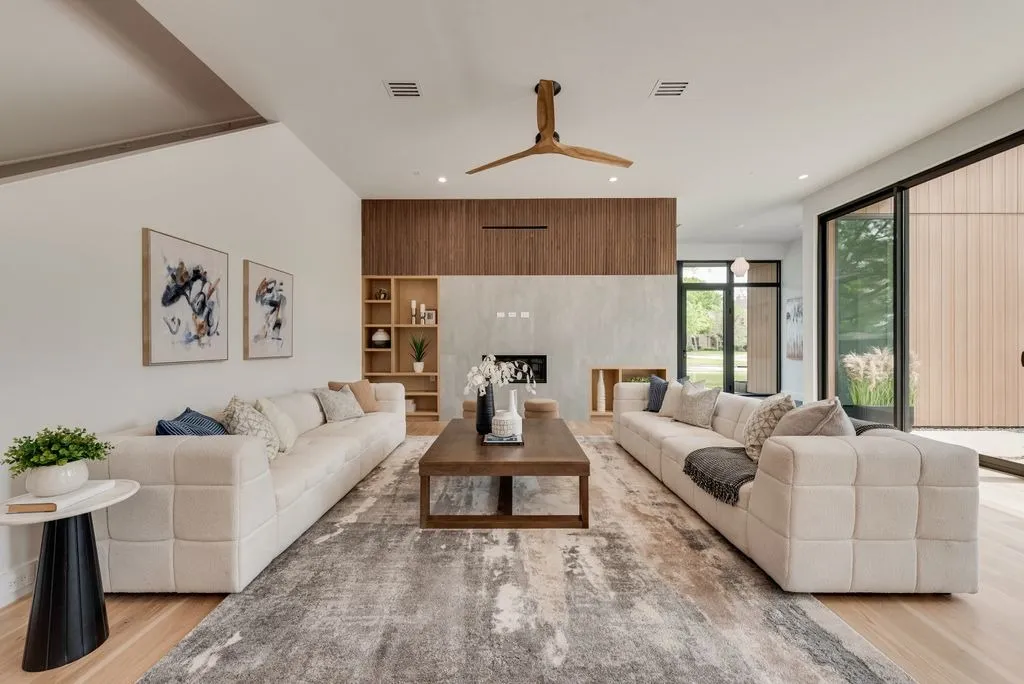 4103 Saranac: living room with two long sofas facing a fireplace wall