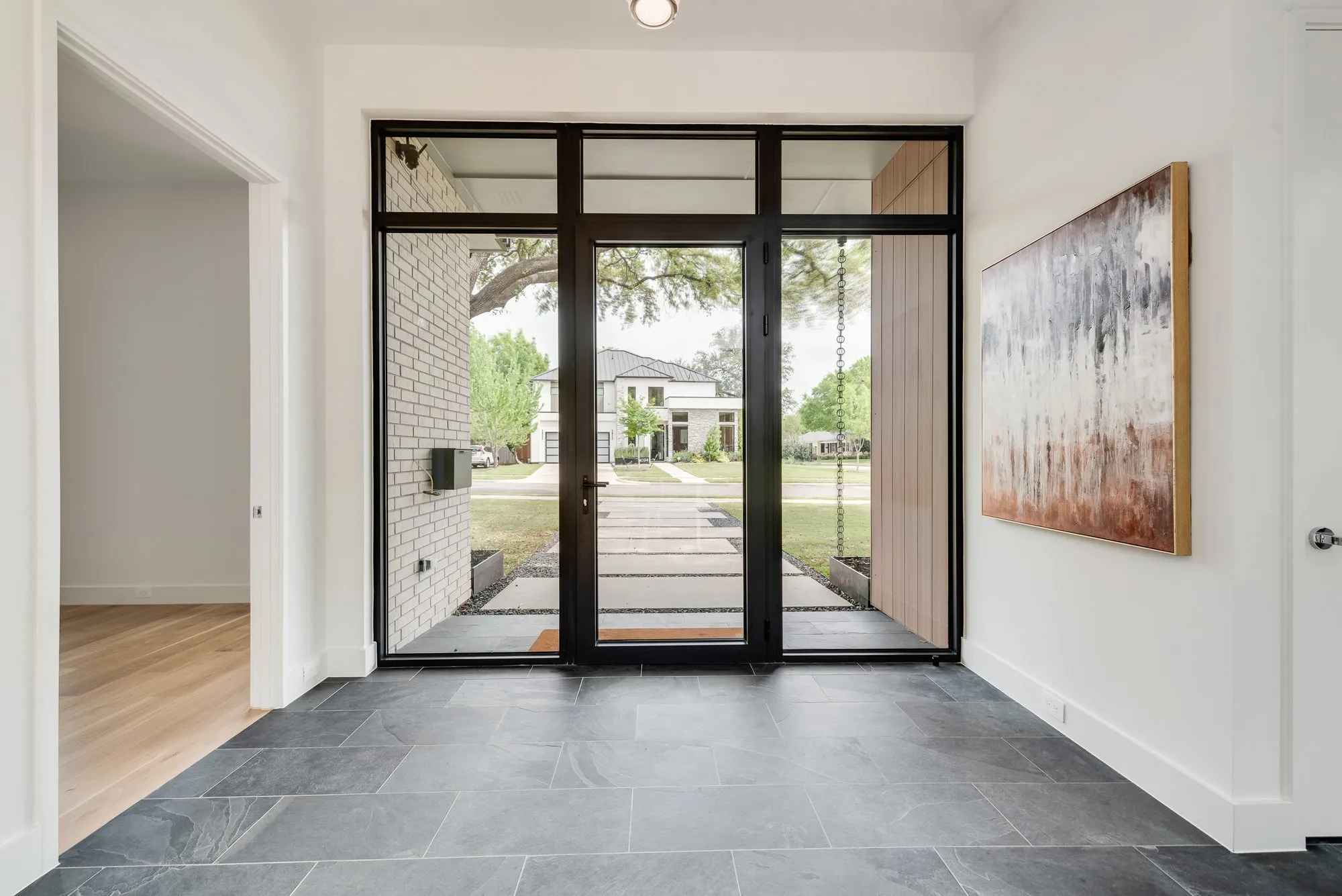4103 Saranac: entry hall with a slate floor and glass front doors