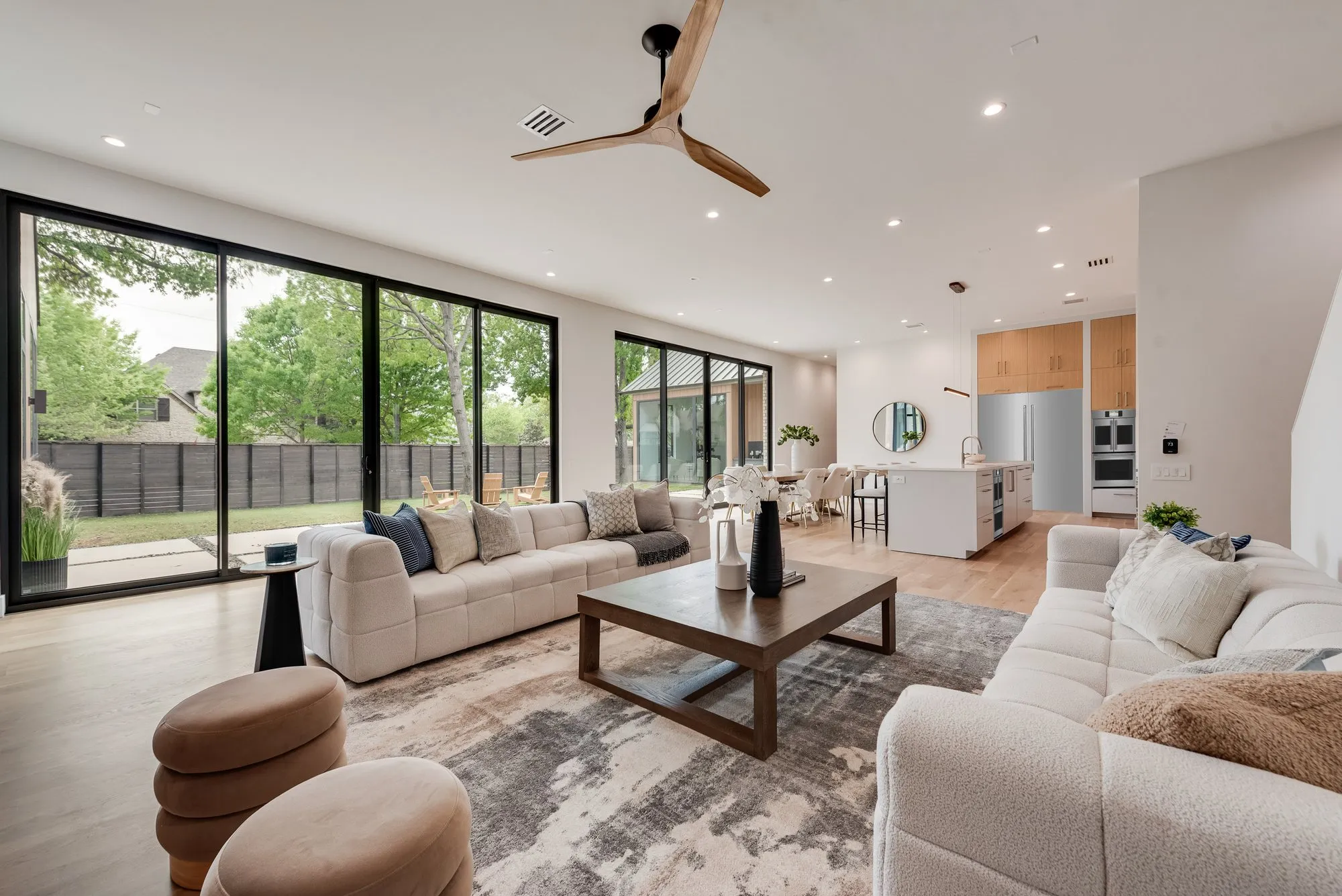 4103 Saranac: living room open to the kitchen, with sliding glass doors to the yard