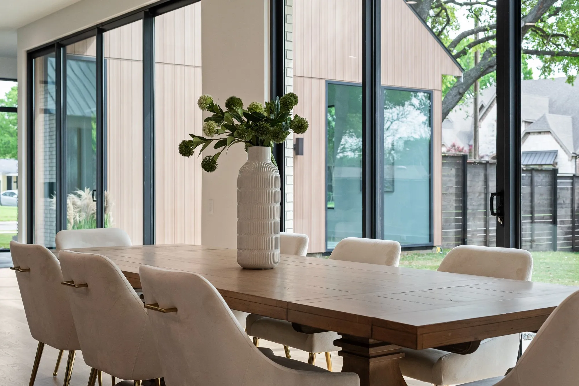 4103 Saranac: dining table beside floor-to-ceiling windows