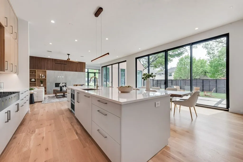 4103 Saranac: kitchen with a long white island, open to the dining and living areas