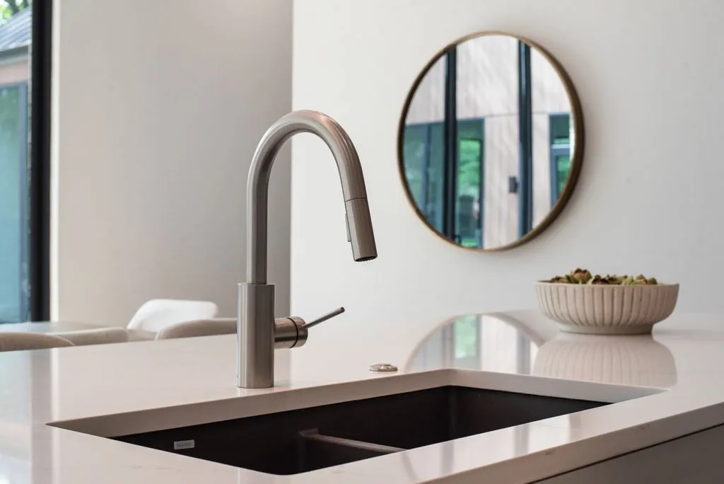 4103 Saranac: kitchen island sink with a brushed metal faucet